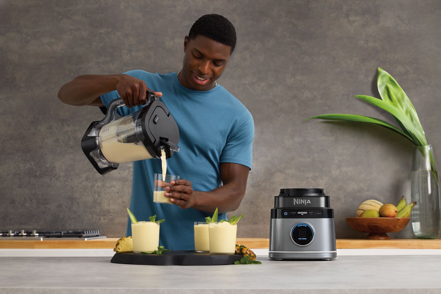 Ninja-TB201-InUse-Kitchen-Island-IceCrush-Margarita-Pour-Man